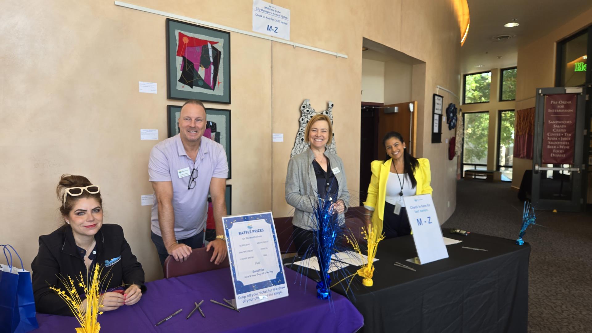 Department heads helping check in employees for City Manager's Update event.